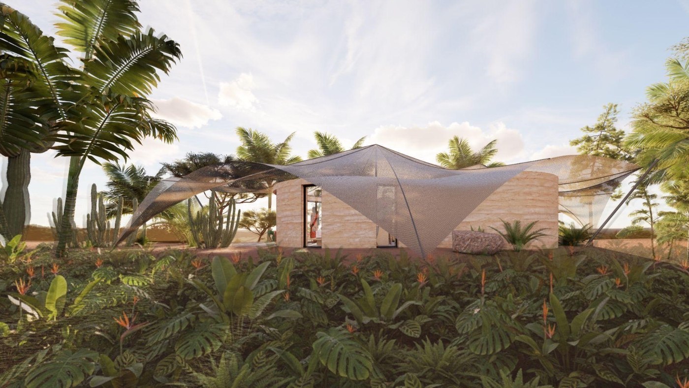 The cabin's woven mesh canopy stretched over curved rammed-earth walls, seen from the tropical garden