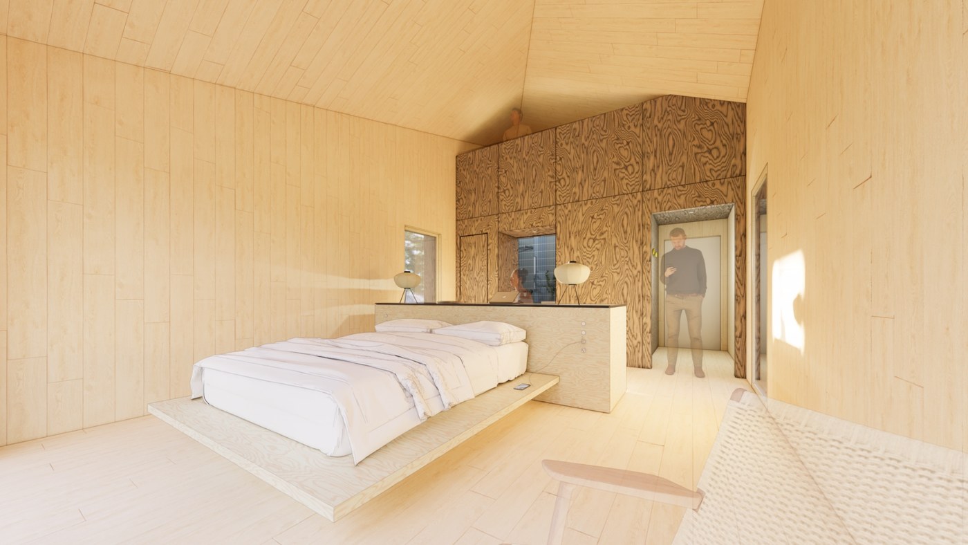 Main space with a platform bed, light wood walls, and the utility island behind the headboard